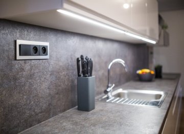 How to effectively incorporate switches and sockets into an apartment?